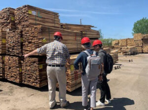 Wood buyers from Taiwan viewing unsteamed walnut lumber