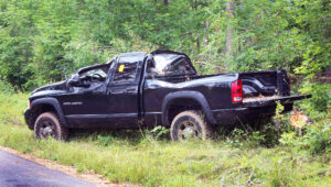 Photo showing the cab of a pickup truck after it was smashed by a fallen tree during the 2019 derecho windstorm that ravaged forestland in Northeastern Wisconsin.