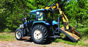 Photo of a roadxside flail mower that can make work easier and more productive for town crews, but can cause deadly damage to oak trees in the vicinity.