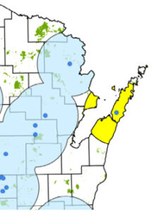 A map of northeastern Wisconsin showing the 25-mile buffer for the new discovery in Door County (in yellow) and existing nearby buffer zones in light blue, with detection spots in dark blue.