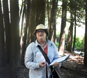 Photo showing Mary Bartkowiak, the Wisconsin Department of Natural Resources' recently retired Forestry Invasive Plants Coordinator, giving a presentation on invasive plants at the University of Wisconsin's Kemp Natural Resources Station in Woodruff.