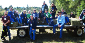 Members of the Wisconsin Woodland Owners Association (WWOA) gather for a hayride back to their vehicles after a field day stop as part of the WWOA's annual meeting.