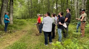 Linda Williams, DNR Forest Health Specialist for the Northeast Zone, addresses forestry workers.