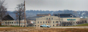 external wide-angle view of a paper mill building