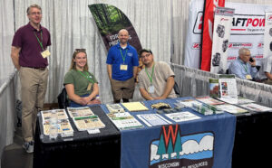 A group of workers at a convention booth
